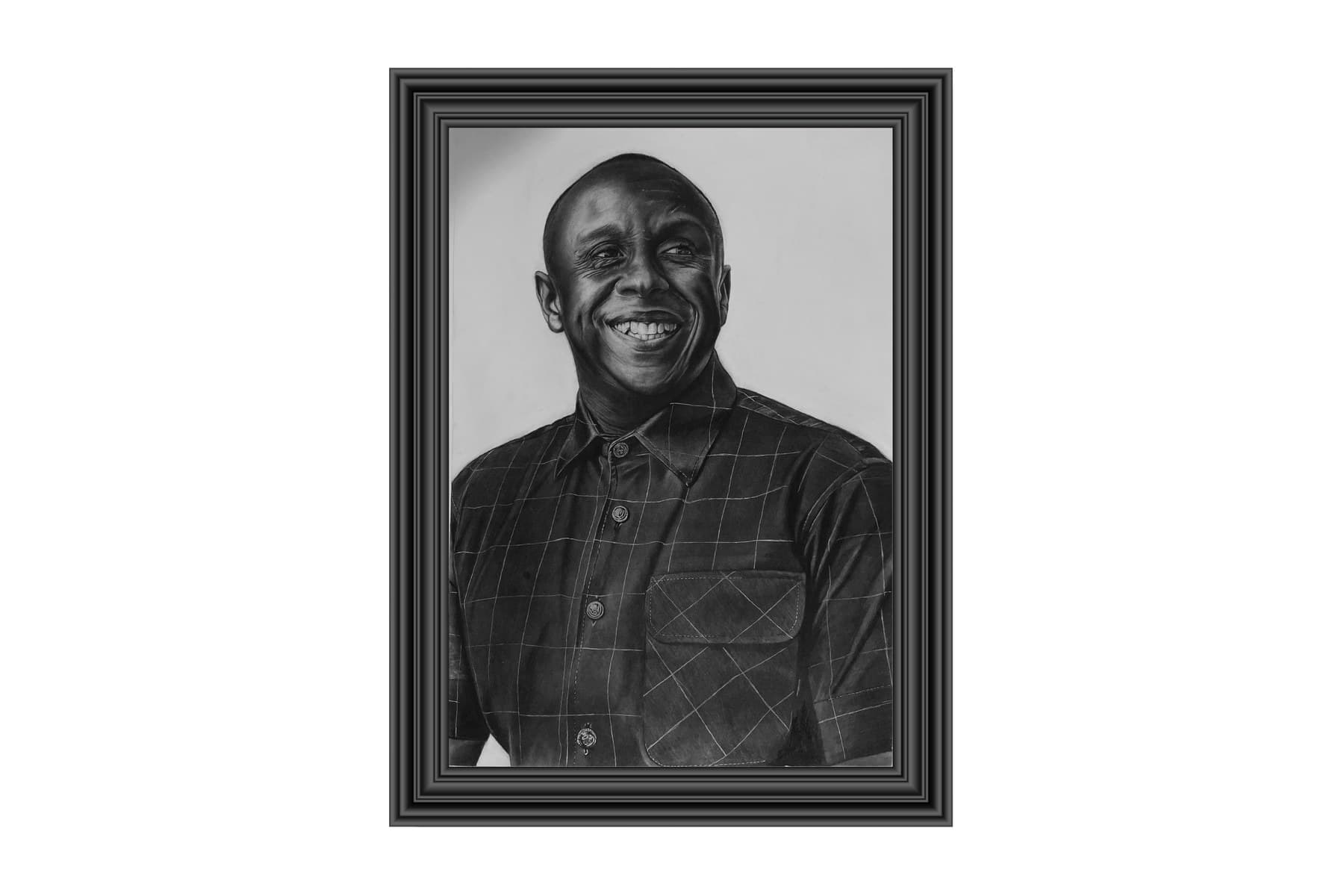 A framed charcoal portrait commission, hand-drawn by Levi